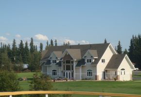 Fairbanks Expensive homes along river bank.jpg